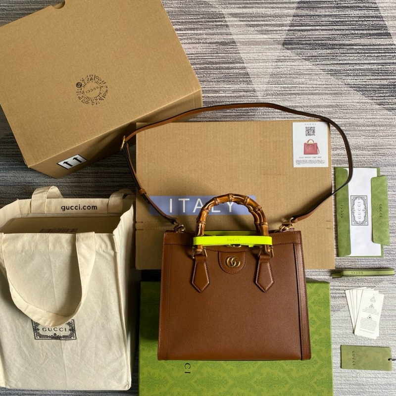 G*u*i top handle bags